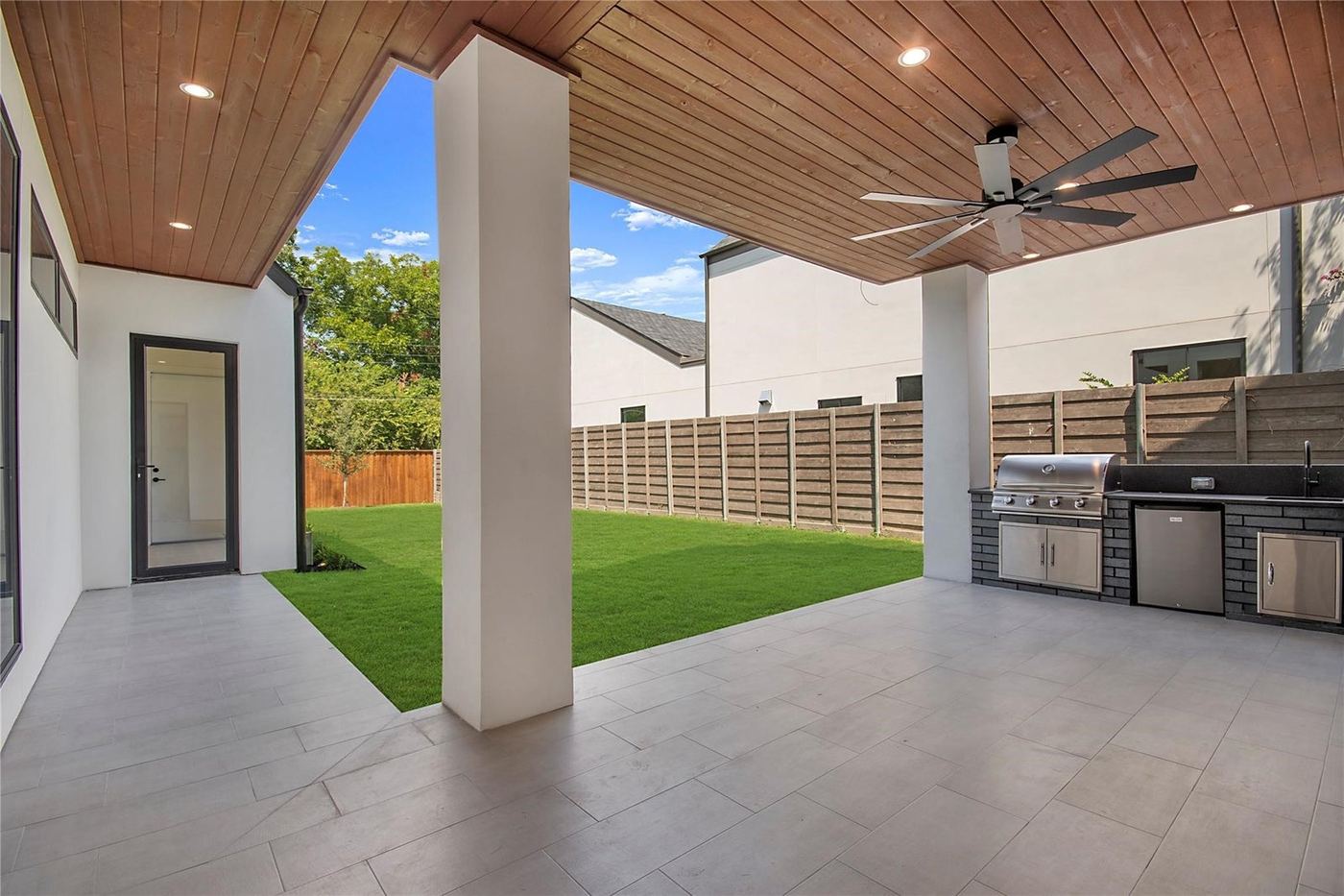 Covered patio with full-height sliding glass doors